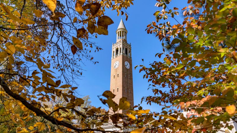 Bell tower surrounded by autumn leaves
