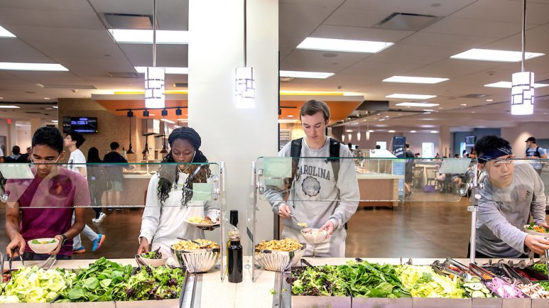 Students get food from dining hall salad bar