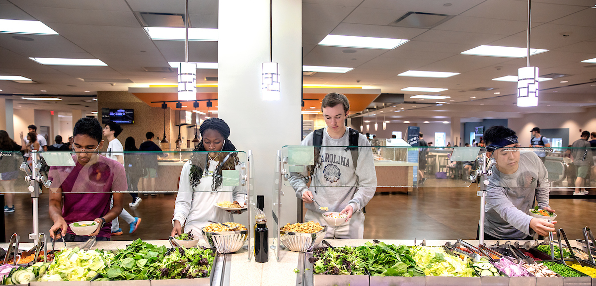 Students get food from dining hall salad bar