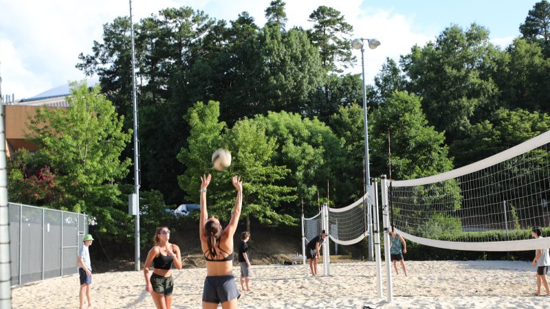 students play summer intramural volleyball