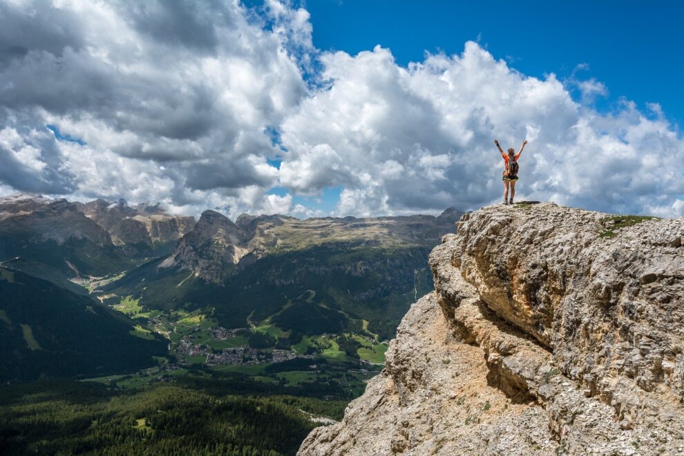 Person stands on mountaintop