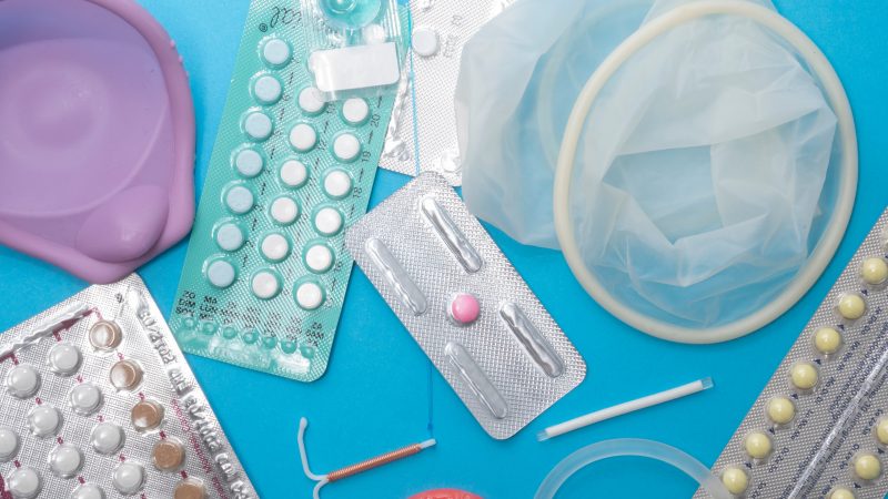 Contraception options strewn around a table