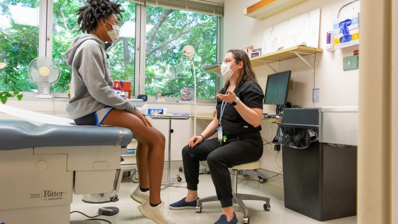 Gynecology provider speaks with a student