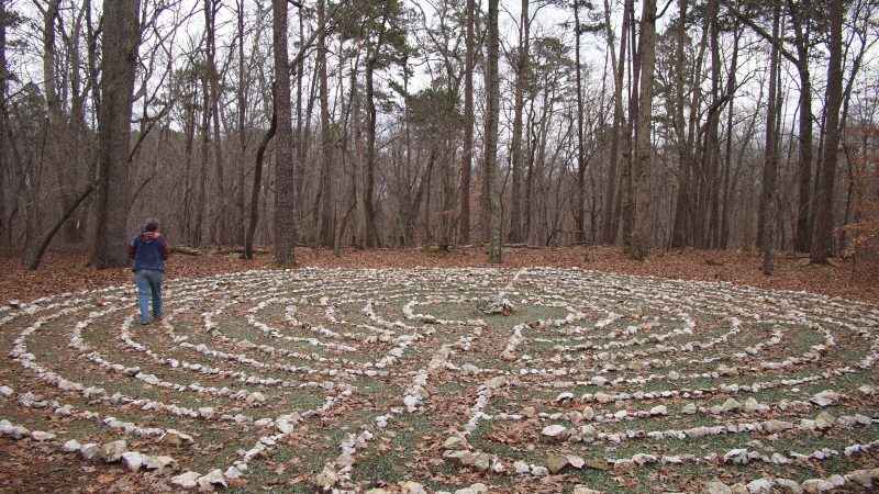 person walks through a labyrinth
