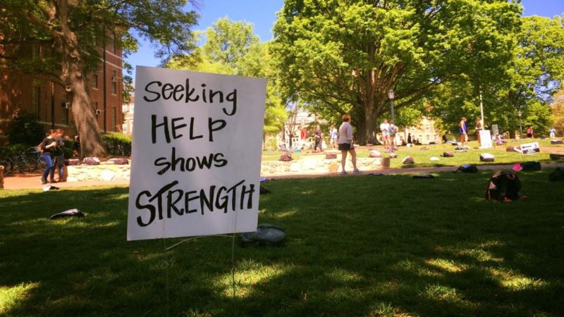 Sign reads Seeking Help Shows Strength