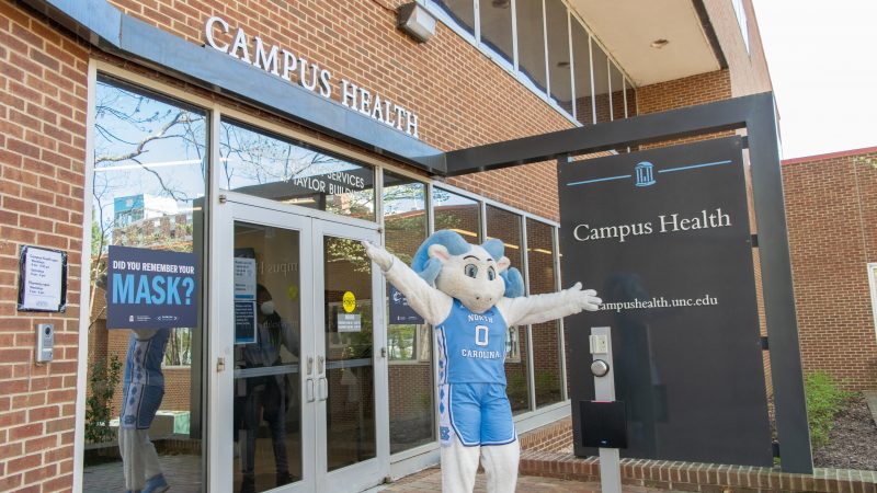 rameses poses outside Campus Health