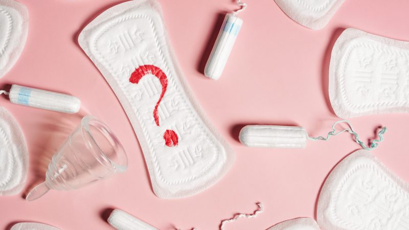 menstrual products including a liner with a red question mark