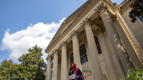 Spiderman sits outside Wilson Library