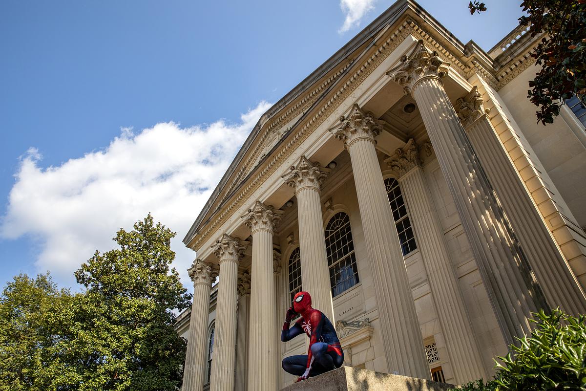 Spiderman sits outside Wilson Library