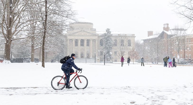 person on a bike in the snowy quad