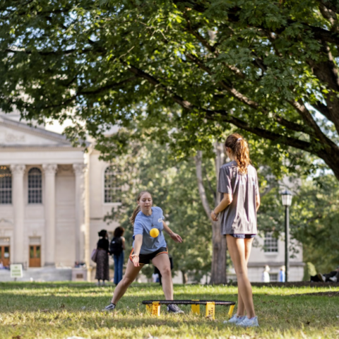 Students play spikeball in the quad